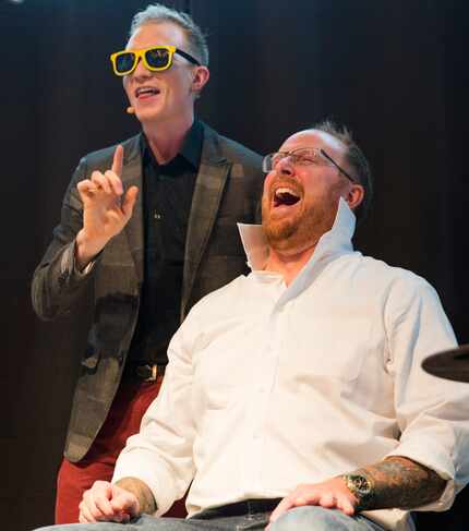 Magician Trigg Watson performs a trick with volunteer Brian Nichols.