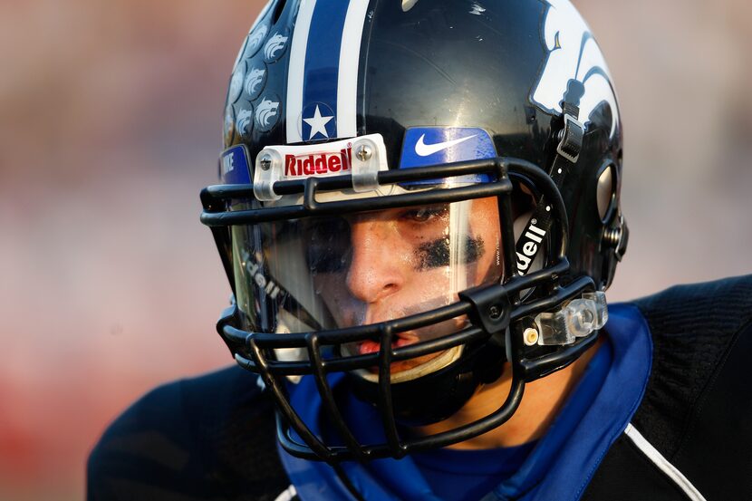 Plano West's Connor Doyle (4) looks to his coach between plays during the Class 5A Division...