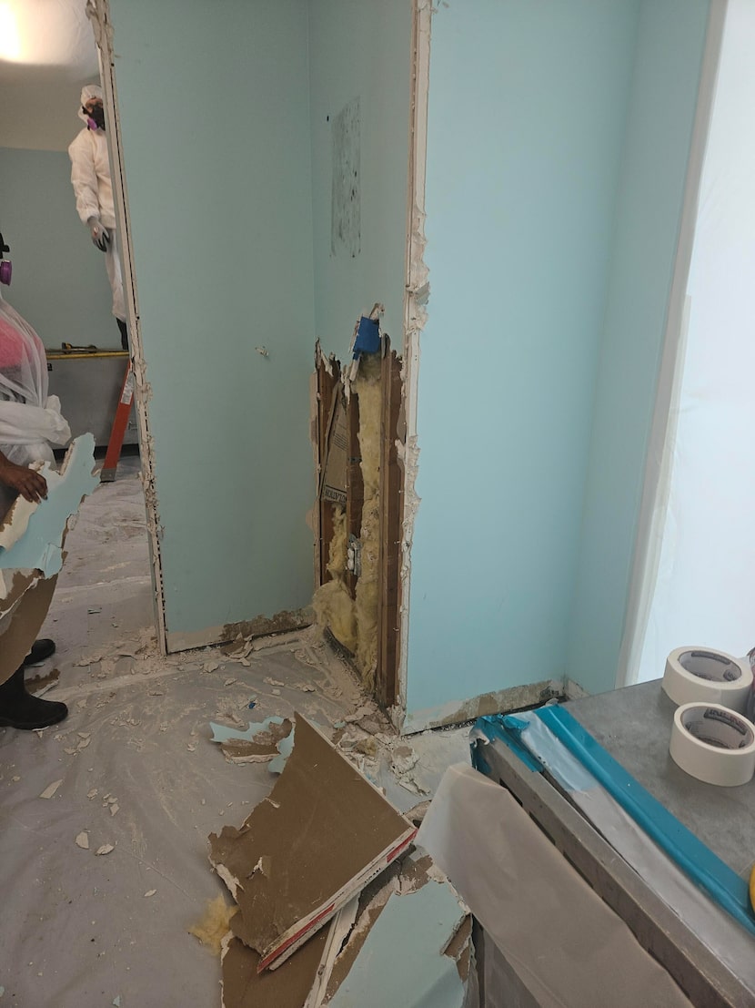 A photo on a cell phone shows the effects of water damage at Family Gateway, a homeless...