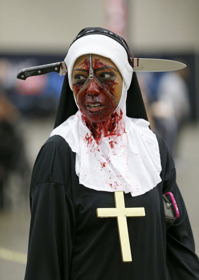 Nedra Hines, of Plano Texas, walks with her zombie make-up during the Walker Stalker event...