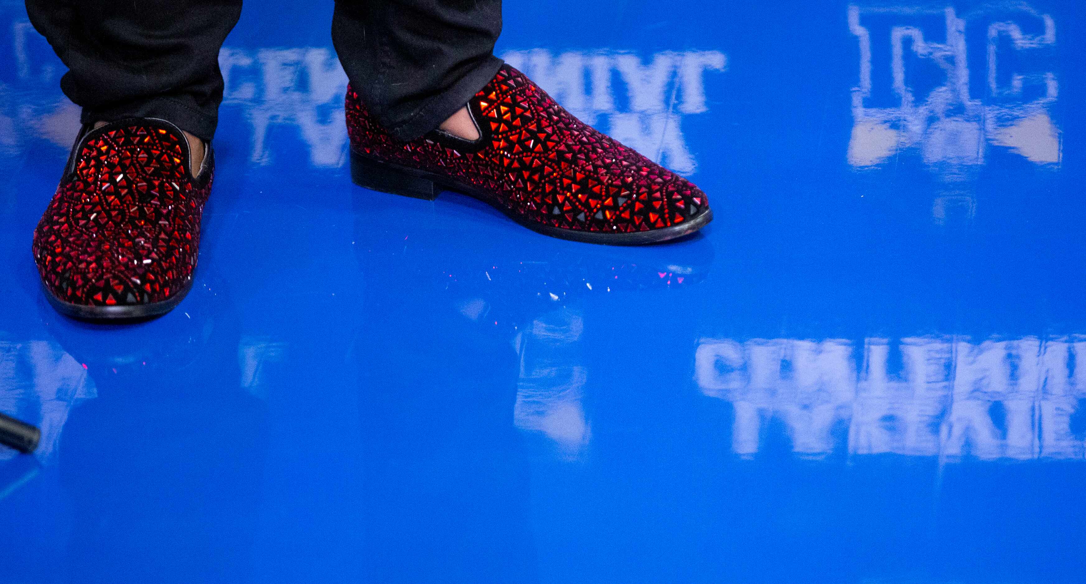 Garland Lakeview Centennial running back Camar Wheaton wears deep red shoes during a signing...