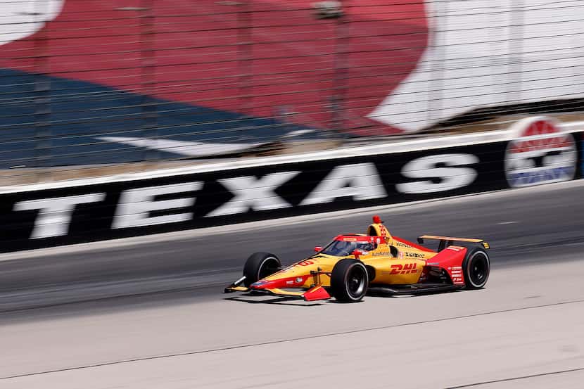 Indy Car driver Ryan Hunter-Reay speeds out of turn 4 as he practices for the upcoming NTT...
