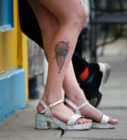 Chloe Roberts leans against a shop along Magazine Street in the Touro neighborhood of New...