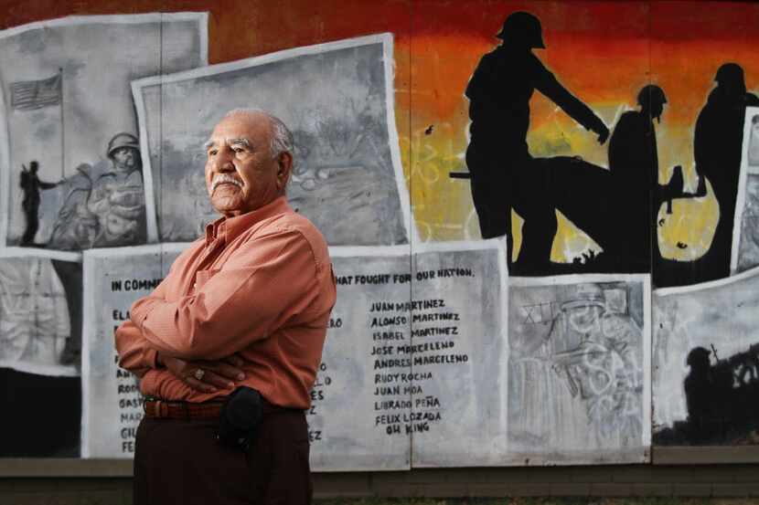 In this 2011 file photo, La Bajada resident and WWII Navy vet poses in front of a mural to...