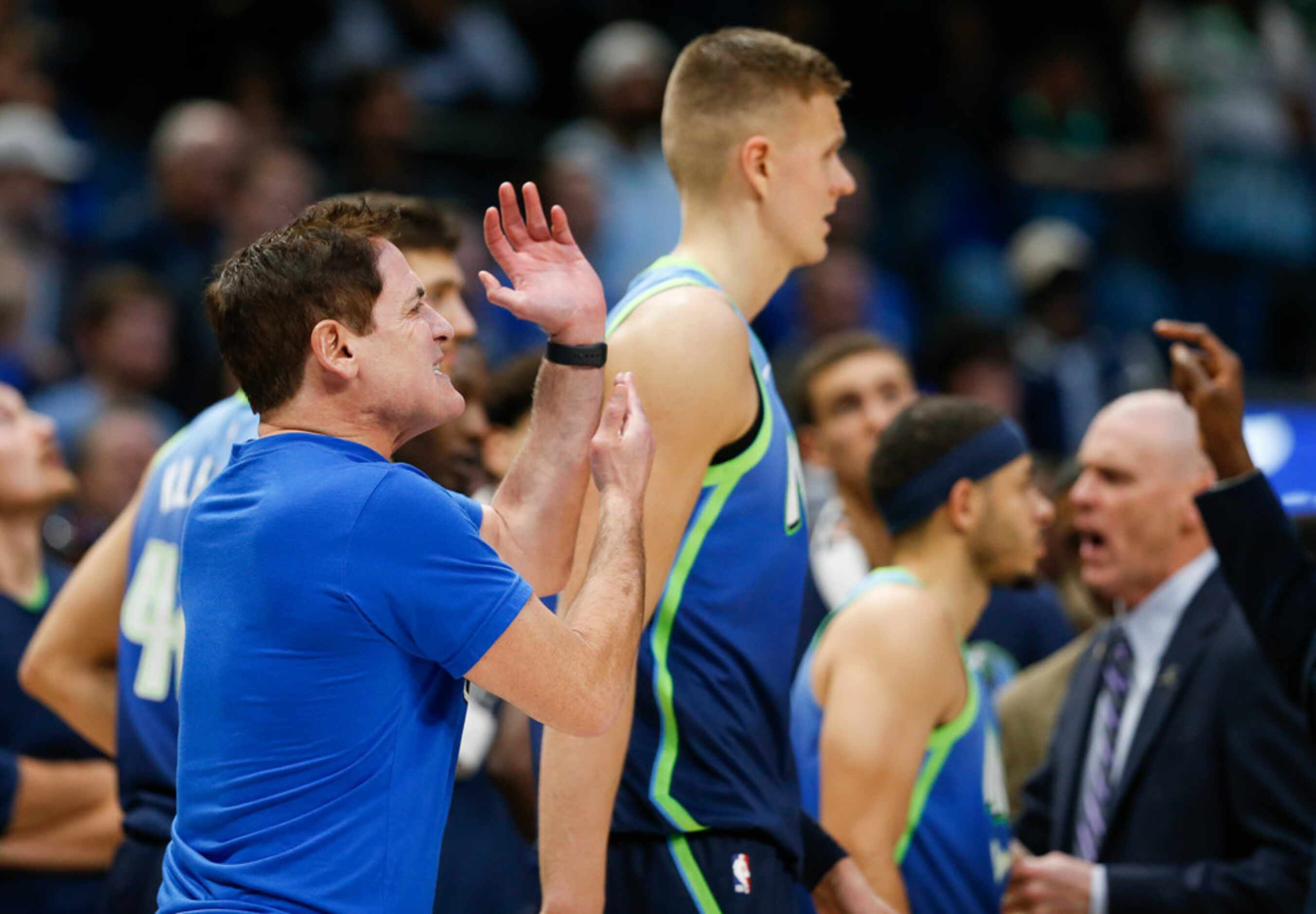 Dallas Mavericks owner Mark Cuban disputes an official's call in the final moments of the...