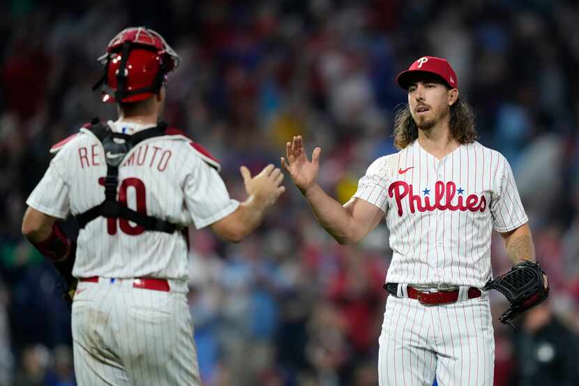 Philadelphia Phillies pitcher Michael Lorenzen, right, and catcher J.T. Realmuto celebrate...