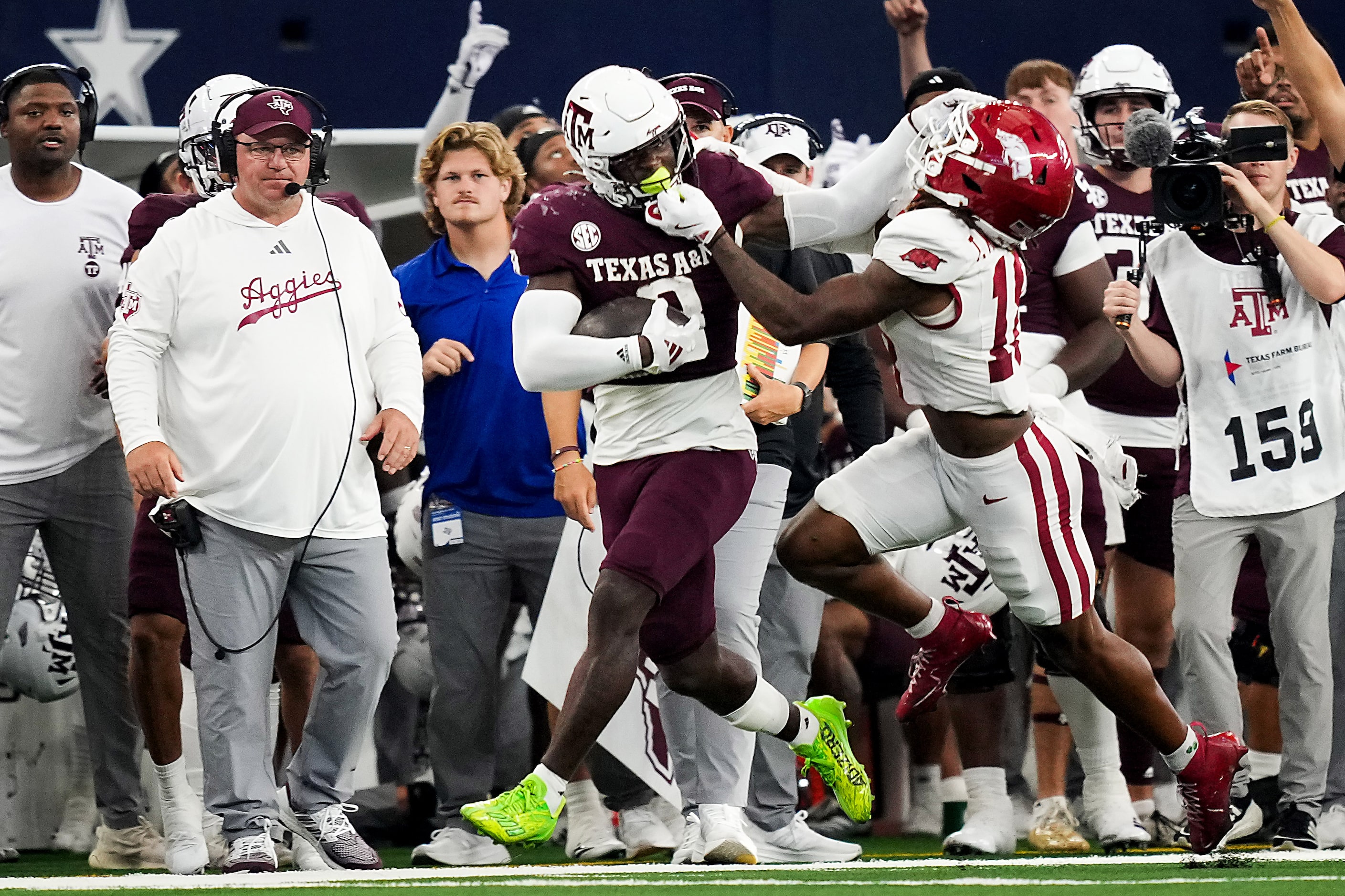 Texas A&M running back Le'Veon Moss (8) picks up a first down as he is pushed out of bounds...