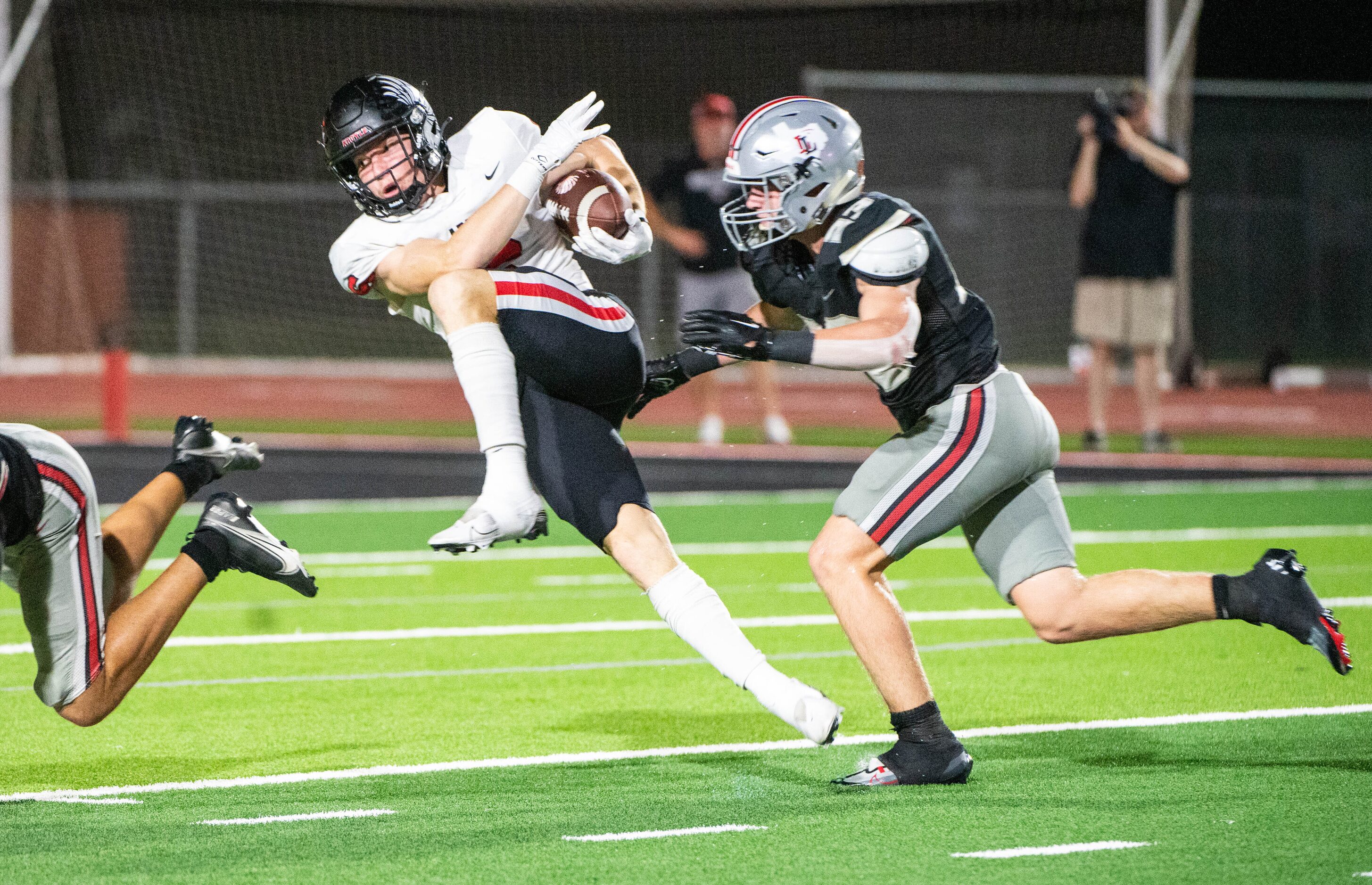 Argyle's wide receiver Lane Stewart (6) runs between Lovejoy’s Avery Fuller (5) and Owen...