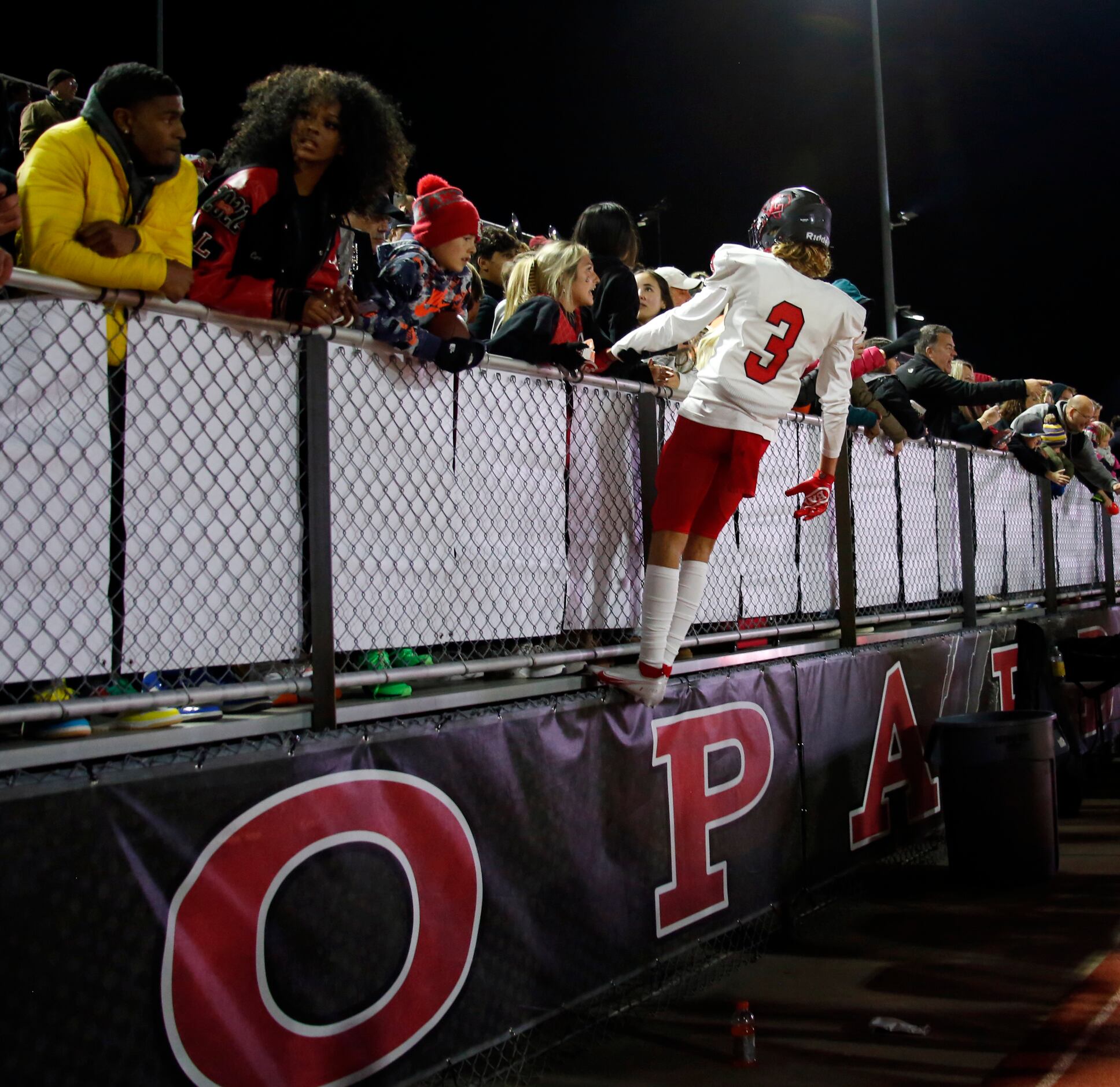 Frisco Liberty receiver Preston Urbine (3) celebrates with fans in the stands following the...
