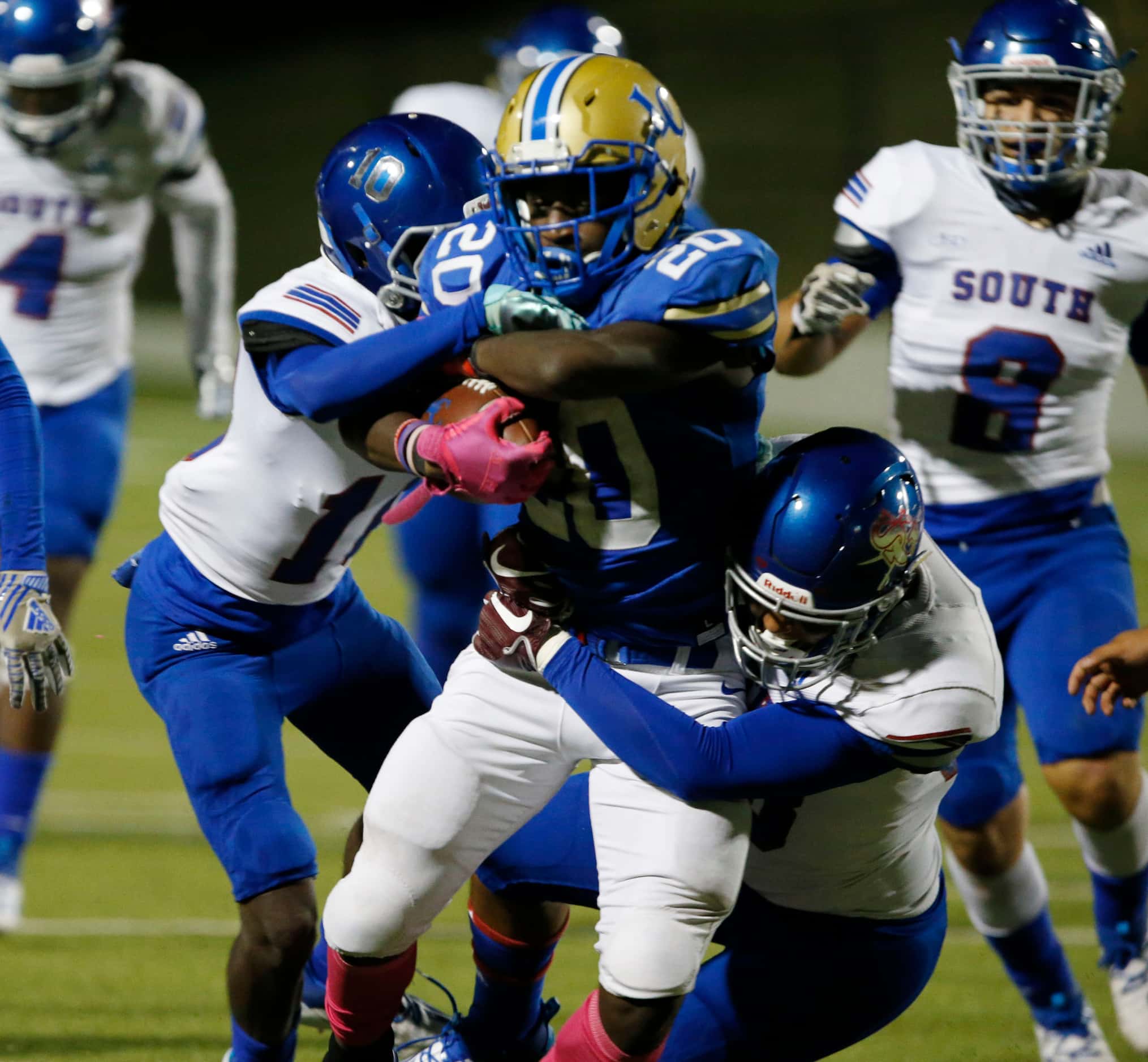 Lakeview RB Zechariah Dunston (20) gains a couple of yards during the first half of high...