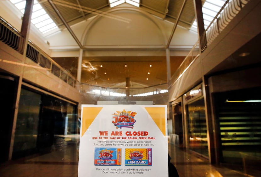 A sign informs people that Amazing Jake's is permanently closed in Collin Creek Mall  in...
