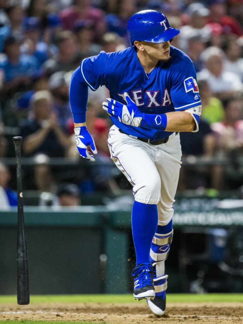 Texas Rangers left fielder Ryan Rua (16) runs to first during the seventh inning of their...