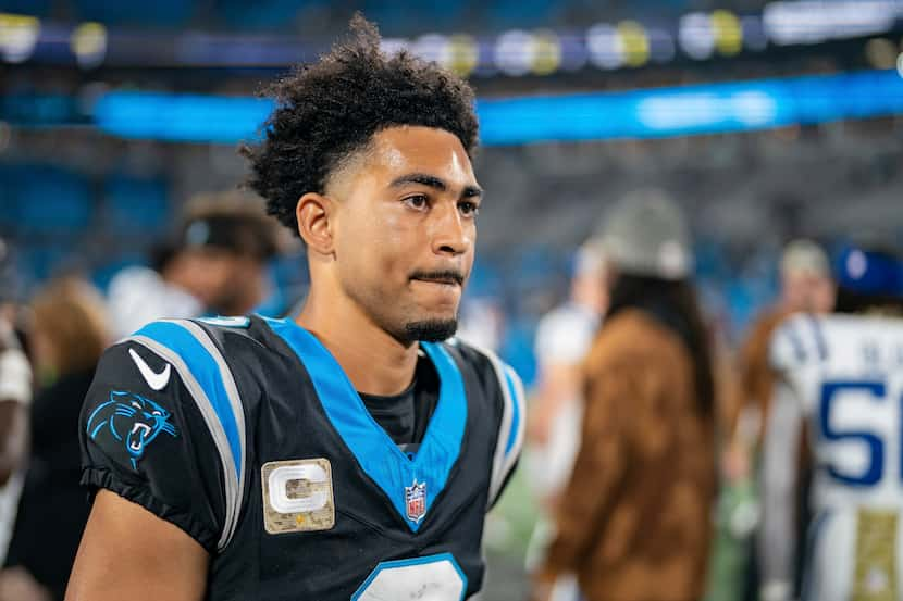 Carolina Panthers quarterback Bryce Young (9) walks off the field after losing to the...