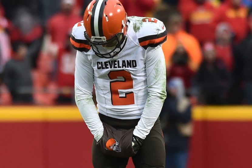KANSAS CITY, MO - DECEMBER 27: Johnny Manziel #2 of the Cleveland Browns hangs his head...
