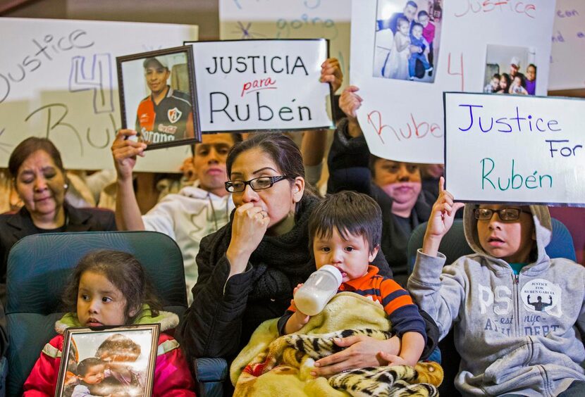 
Martha Anjelica Romero, holding Abdiel, 1, and flanked by her children Keila García (left),...