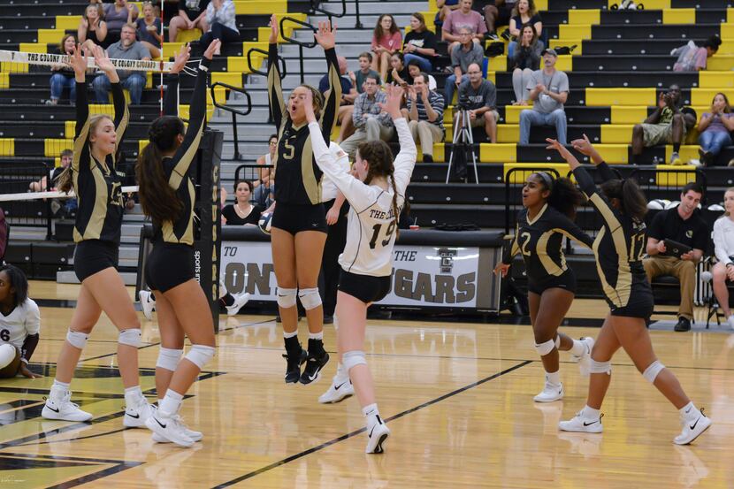 The Colony's Jayda Coleman (5) leaps to celebrate a point with teammates in a recent match....