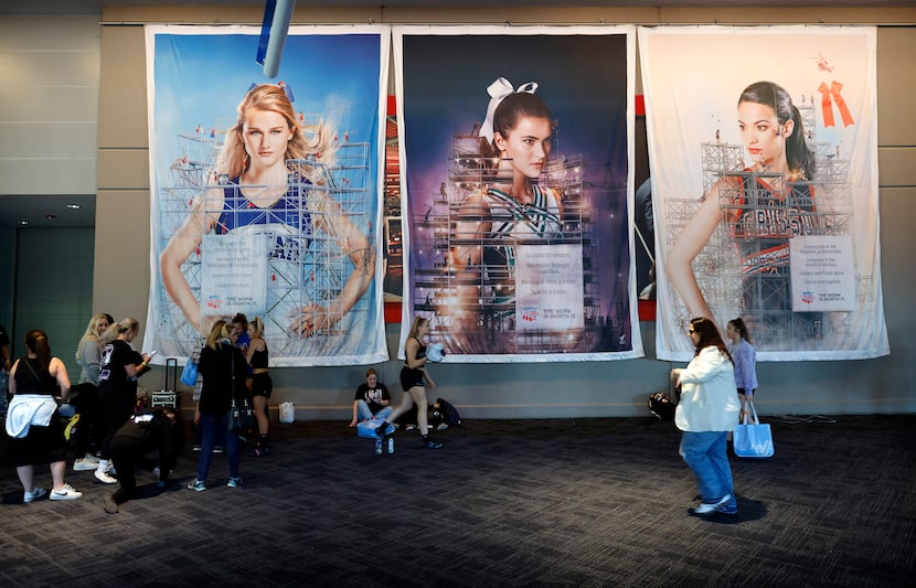 Large artwork of cheer team members grace the wall during the National Cheerleaders...