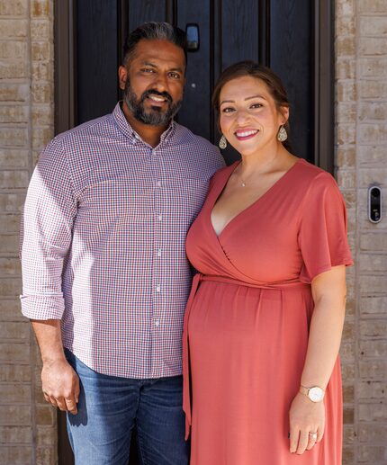 Shaun Alexander stands with his wife Janet Alexander outside their new home in Dallas.