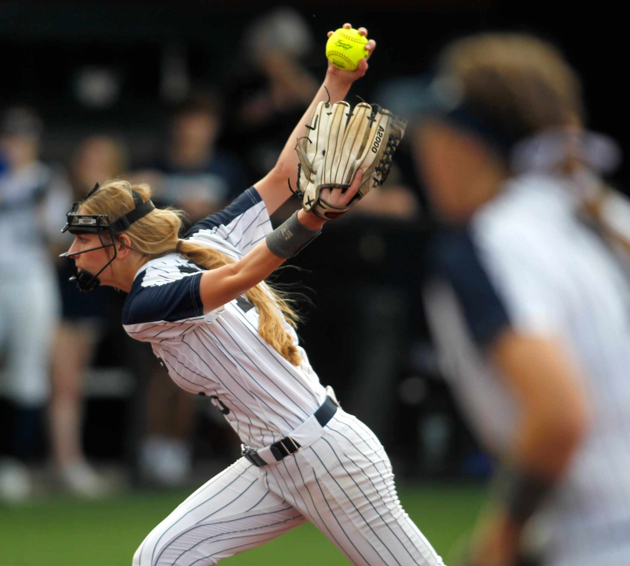 Flower Mound pitcher Landrie Harris (15) delivers a pitch to a Deer Park batter during the...