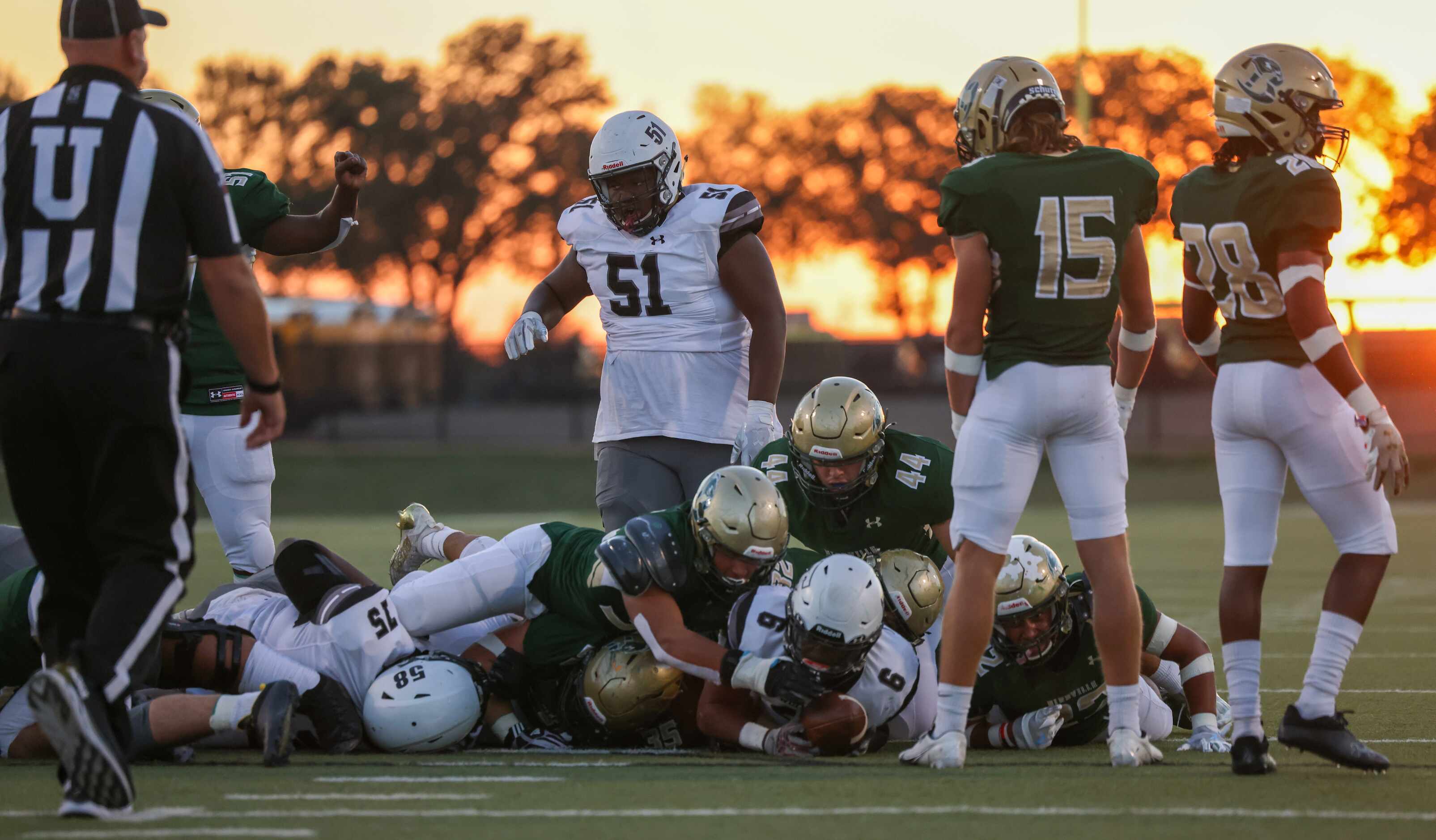 Birdville defenders tackle Mansfield Timberview running back Javeon Madison (6) in the first...