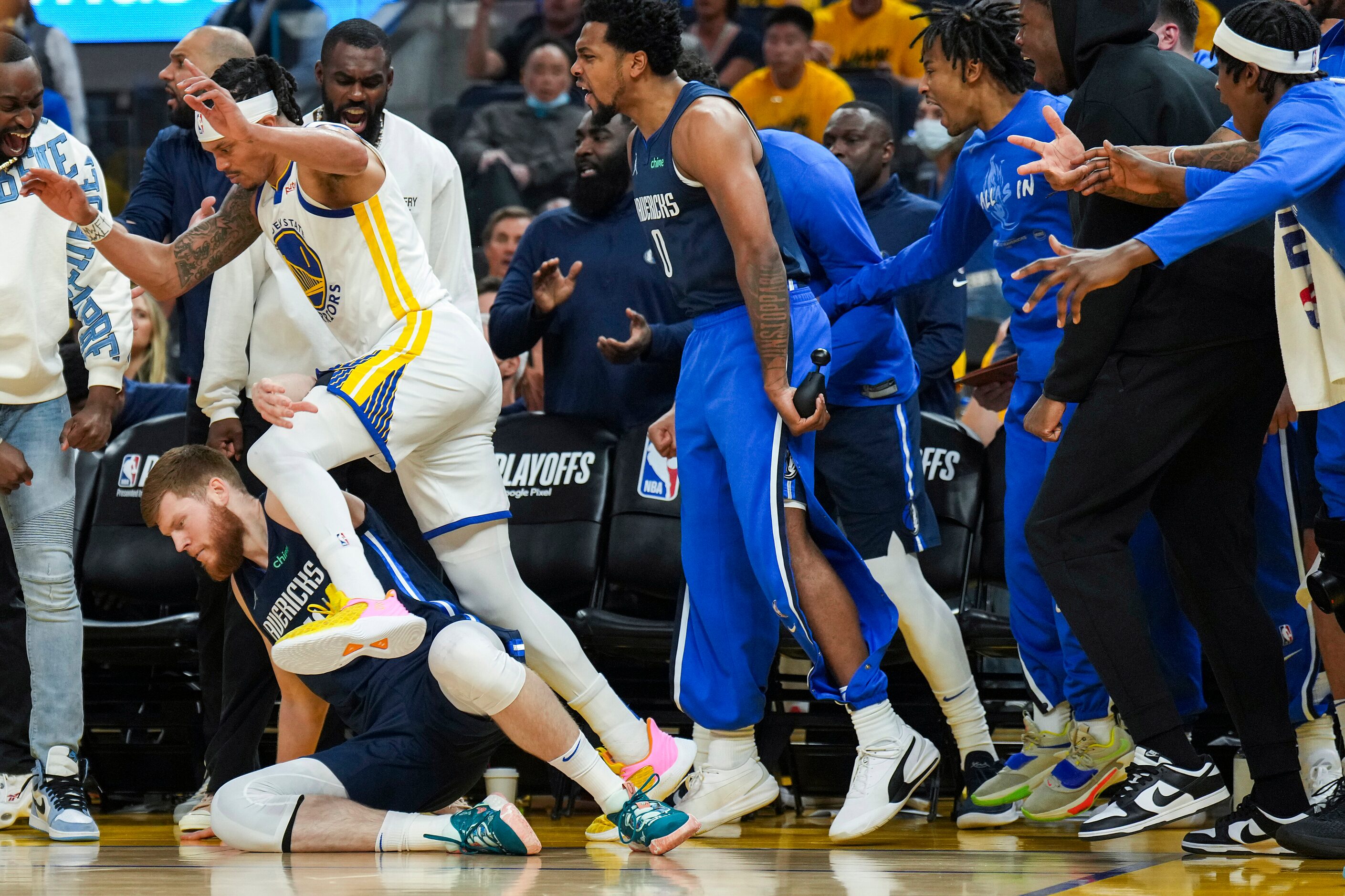 Dallas Mavericks forward Davis Bertans (44) gets tangled with Golden State Warriors guard...