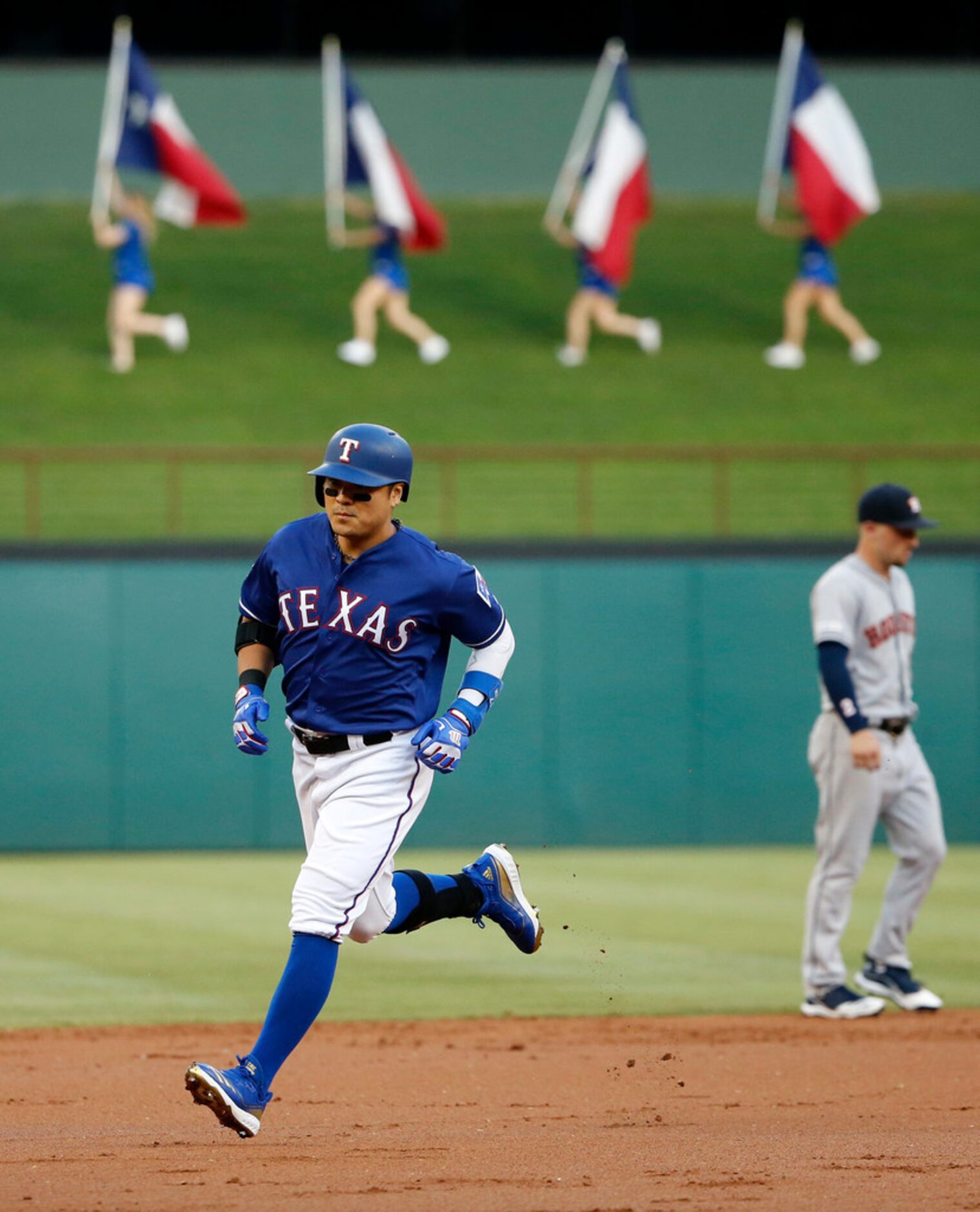 Texas Rangers batter Shin-Soo Choo (17) rounds the bases after his lead-off home run against...