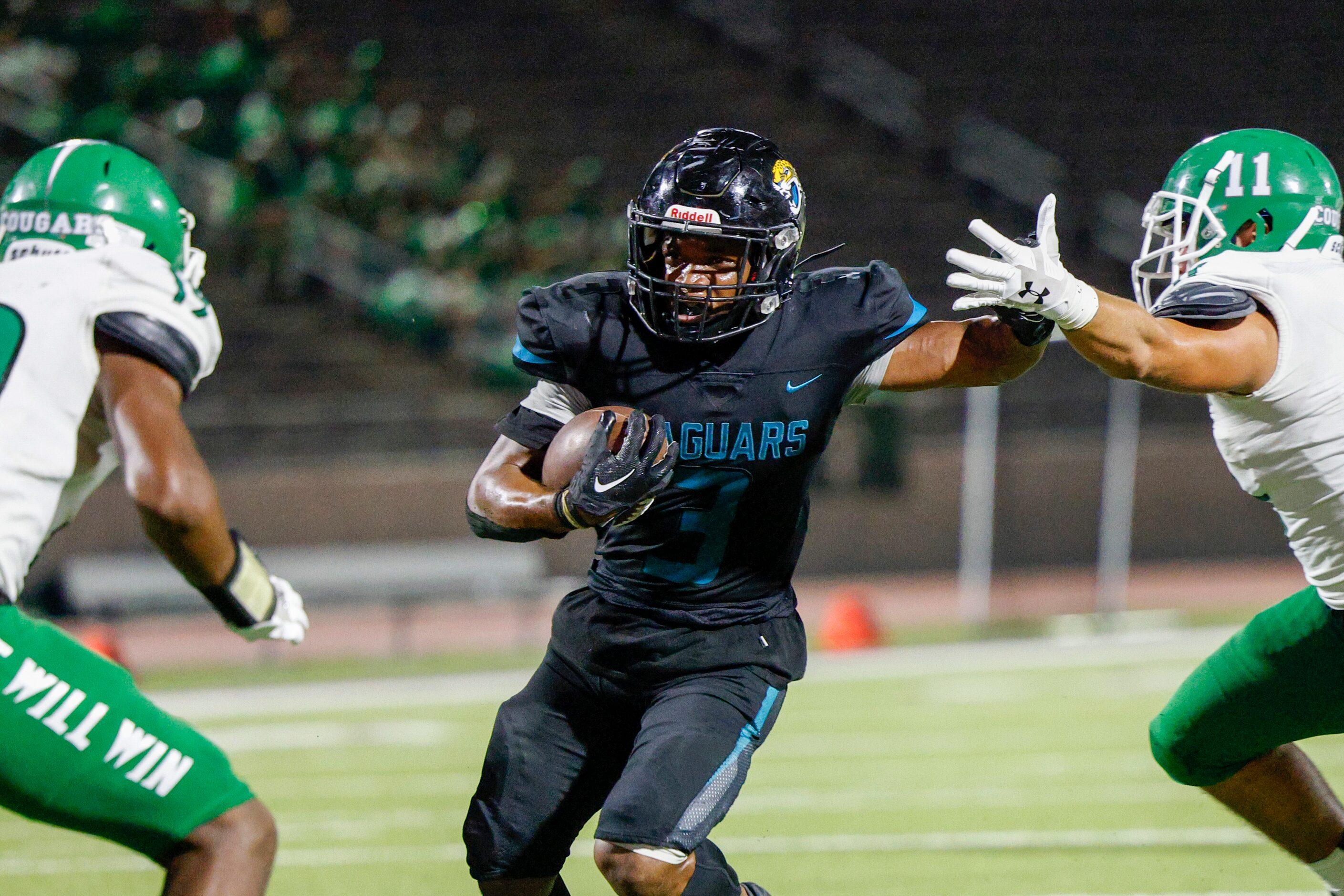 Molina running back Glen Jackson (3) splits Bryan Adams linebackers Buster McCrary (11) and...