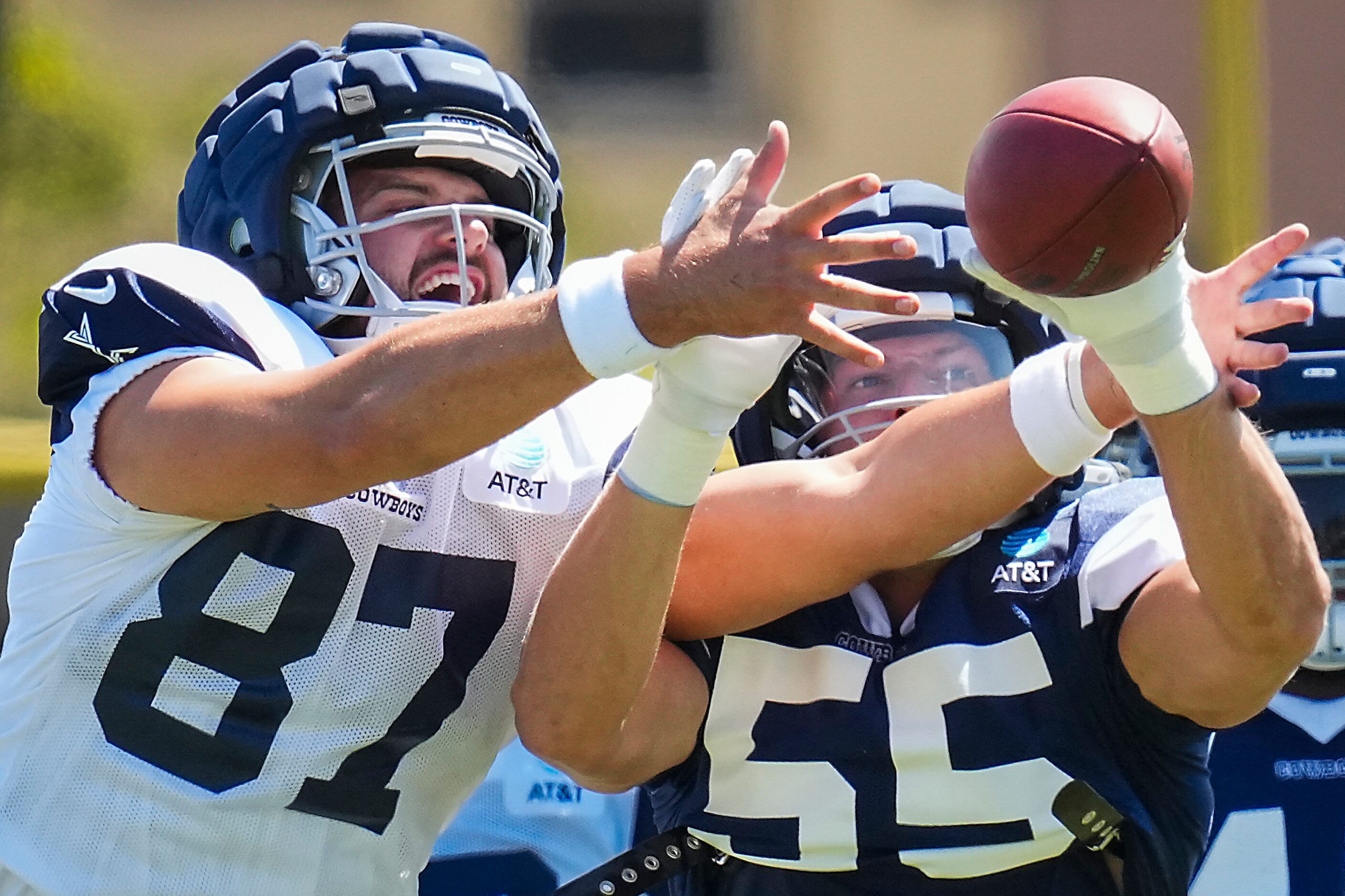 Dallas Cowboys tight end Jake Ferguson (87) reaches for a ball against outside linebacker...