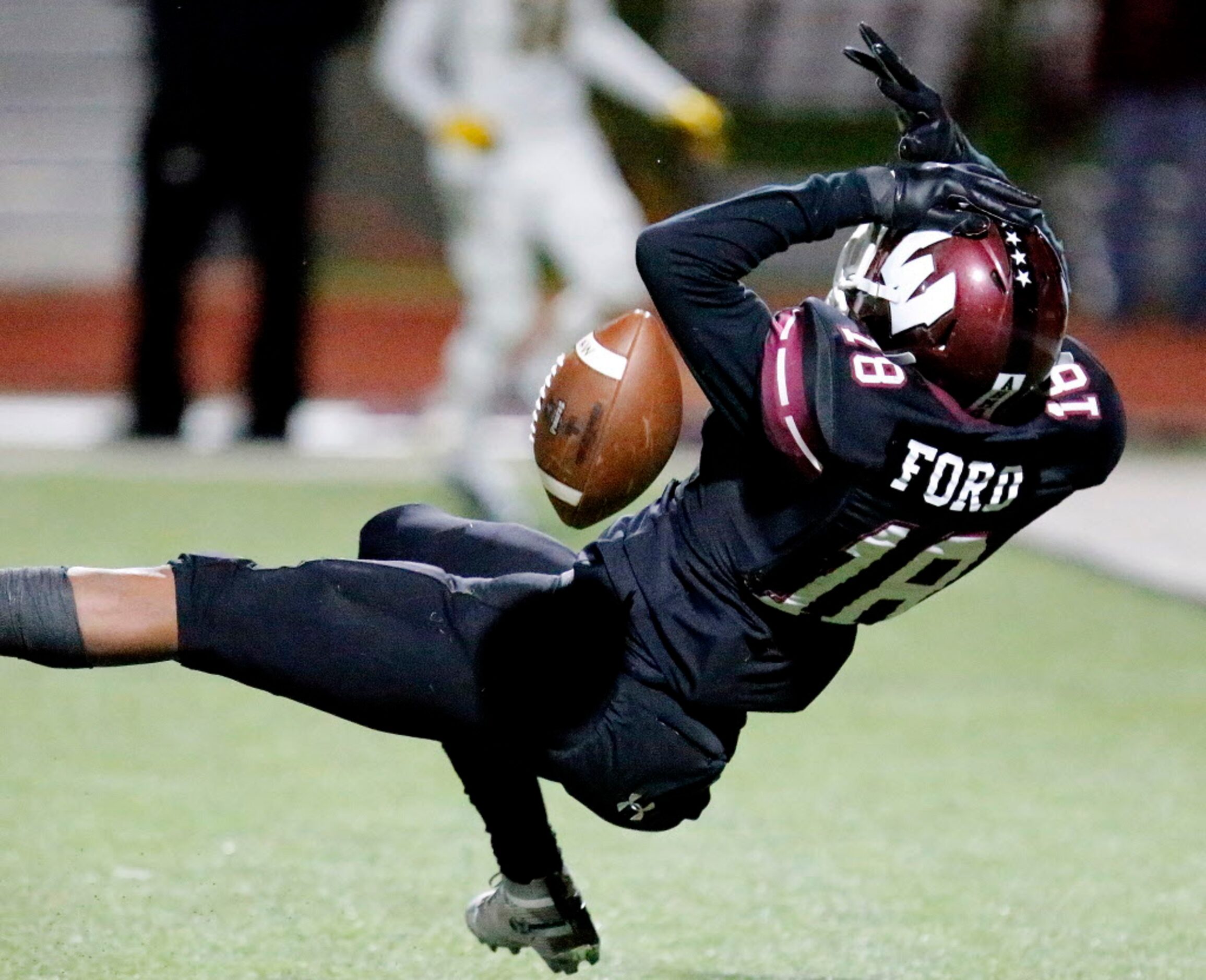 Wylie High School wide receiver Malik Ford (18) was unable to make this catch and shaken up...