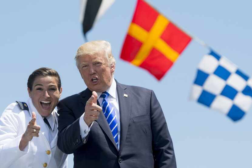 President Donald Trump and newly commissioned Coast Guard Ensign Erin Reynolds during the...