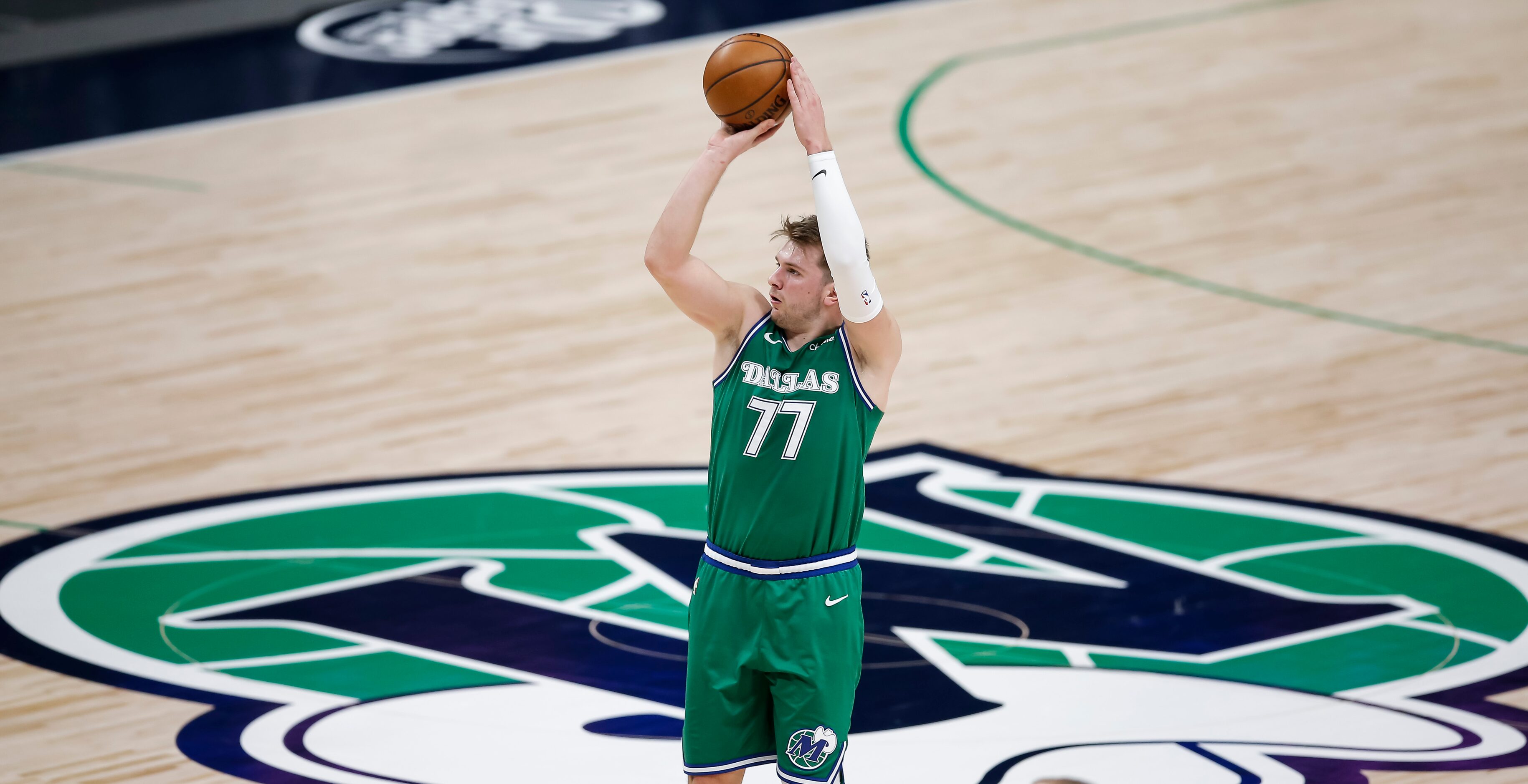 Dallas Mavericks guard Luka Doncic (77) attempts a three-point shot during the second half...