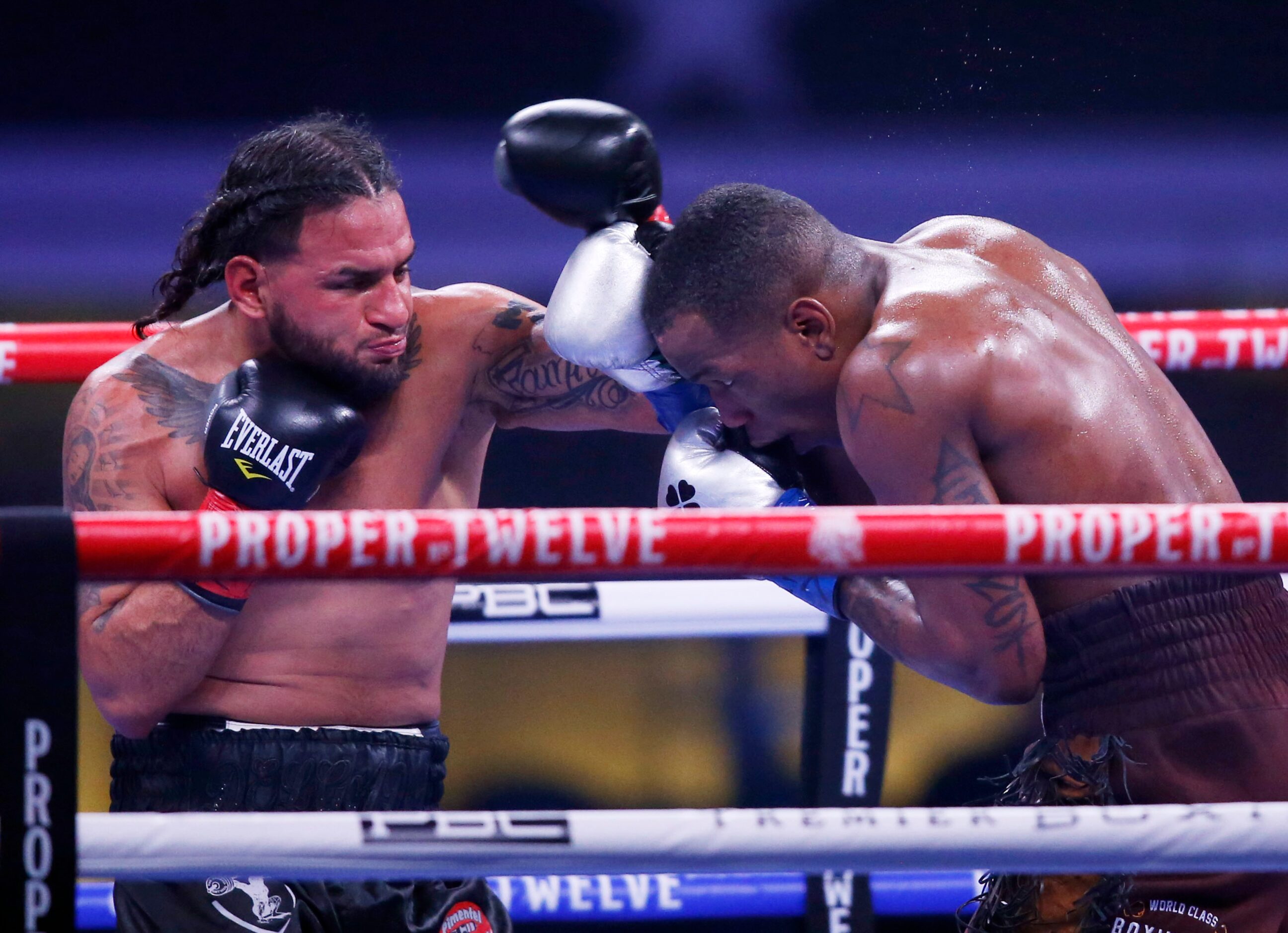 Burley Brooks attempts to block a punch from Marco Delgado during the sixth round at AT&T...