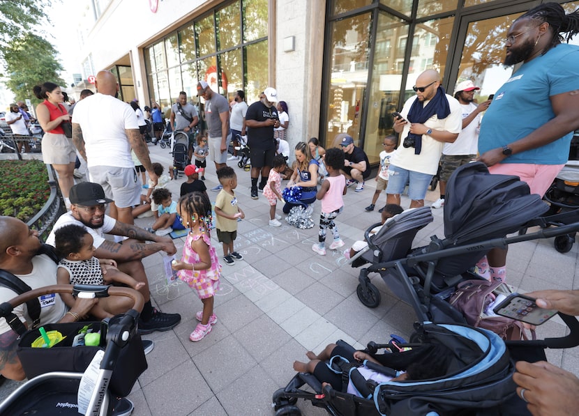 Community members meet during a Daddy Stroller Social Club event at Legacy West in Plano on...