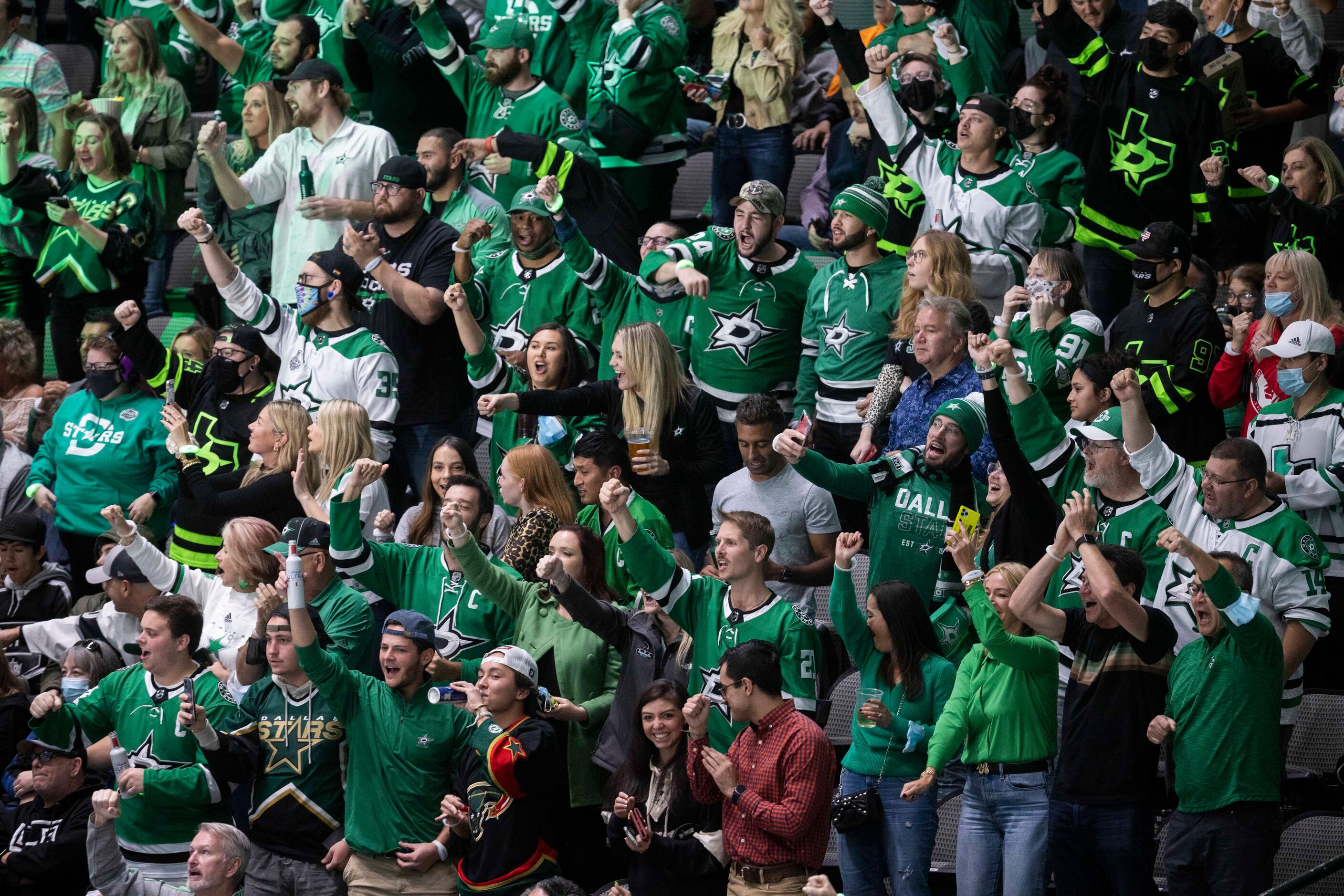 Fans celebrate Dallas Stars center Tyler Seguin’s (91) score during the first period of a...