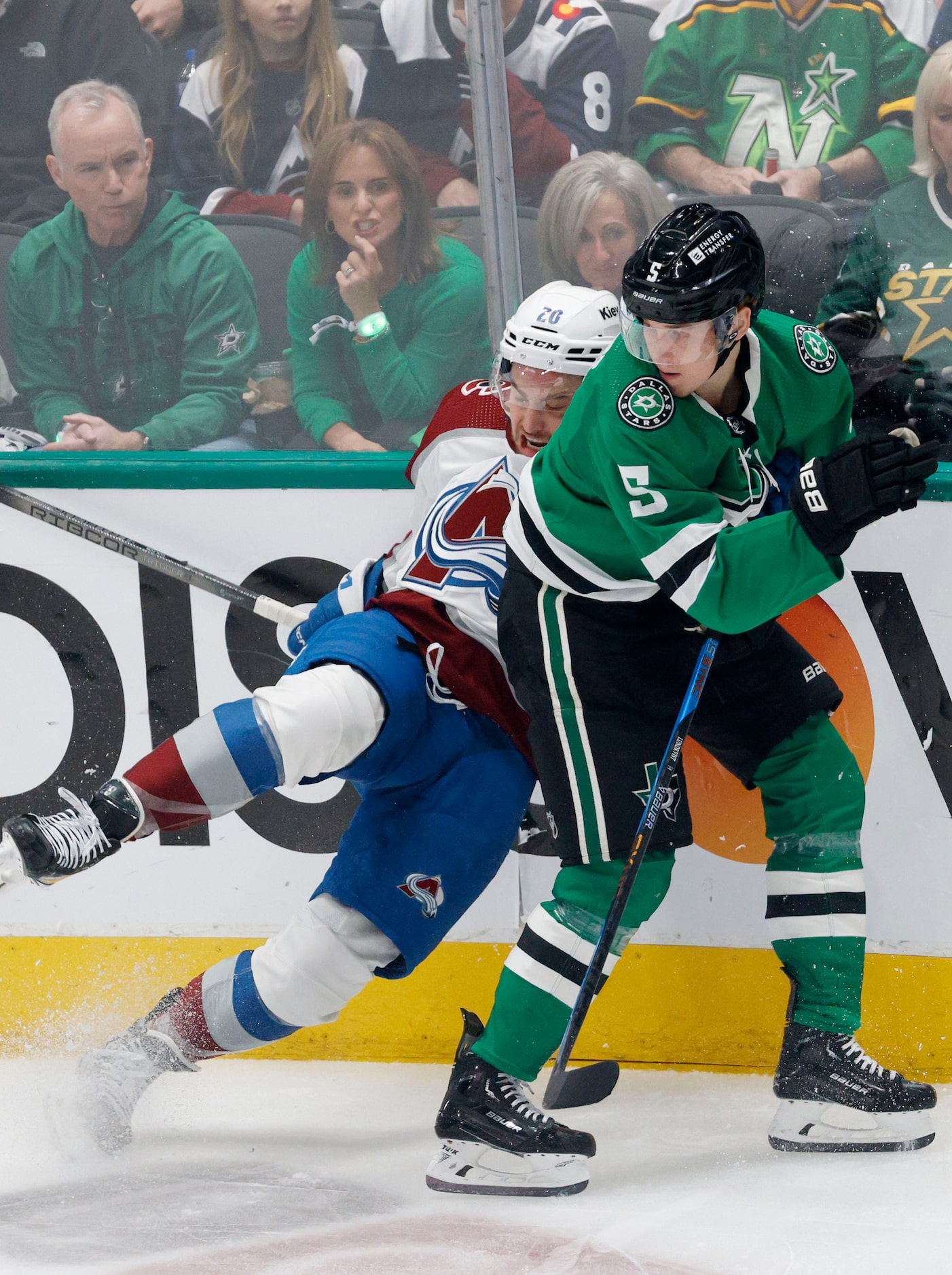 Colorado Avalanche center Ross Colton (20) tangles with Dallas Stars defenseman Nils...