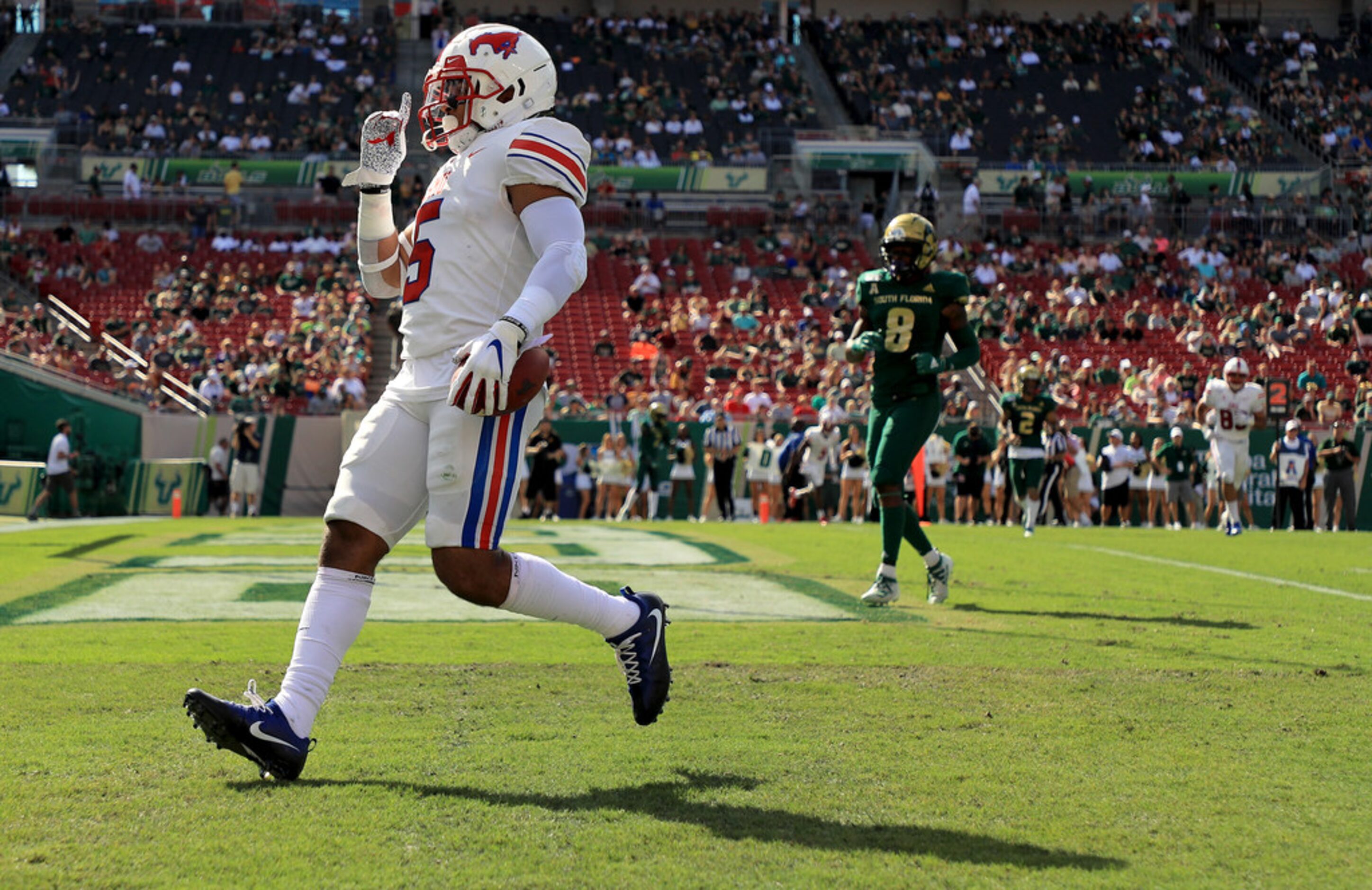 TAMPA, FLORIDA - SEPTEMBER 28: Xavier Jones #5 of the Southern Methodist Mustangs scores a...