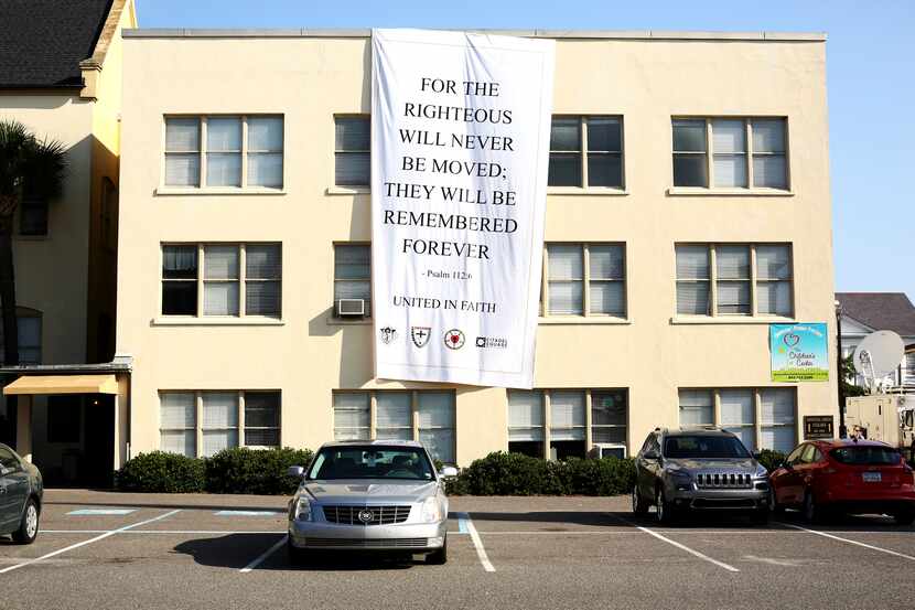 A banner hanging on Citadel Square Baptist Church in Charleston, S.C. on Sunday, June 21,...
