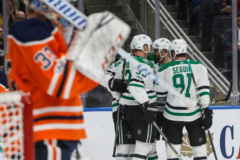 Dallas Stars players celebrate a goal against the Edmonton Oilers during the first period of...