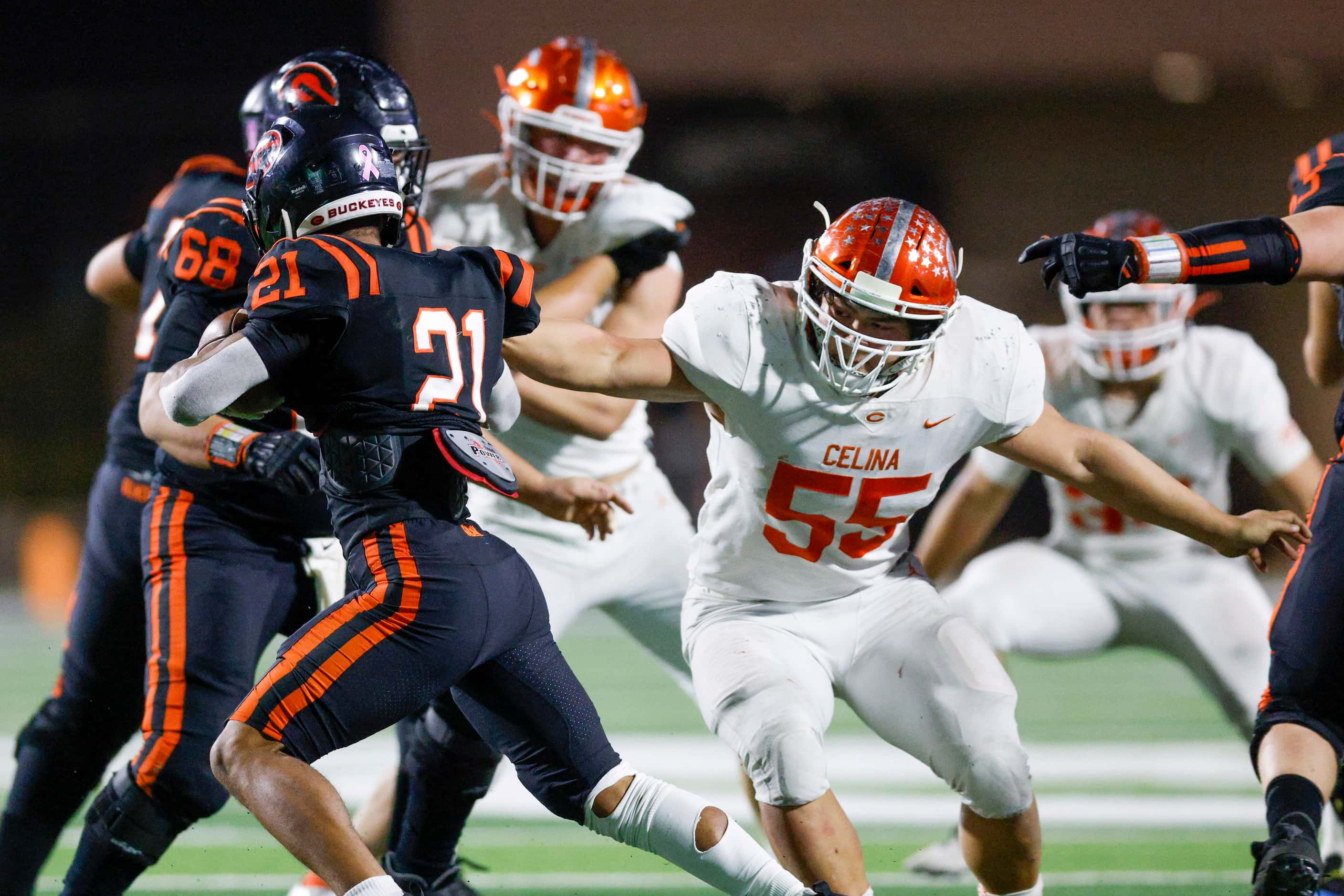 Celina defensive lineman William Pace (55) stretches to tackle Gilmer running back Ladaylon...