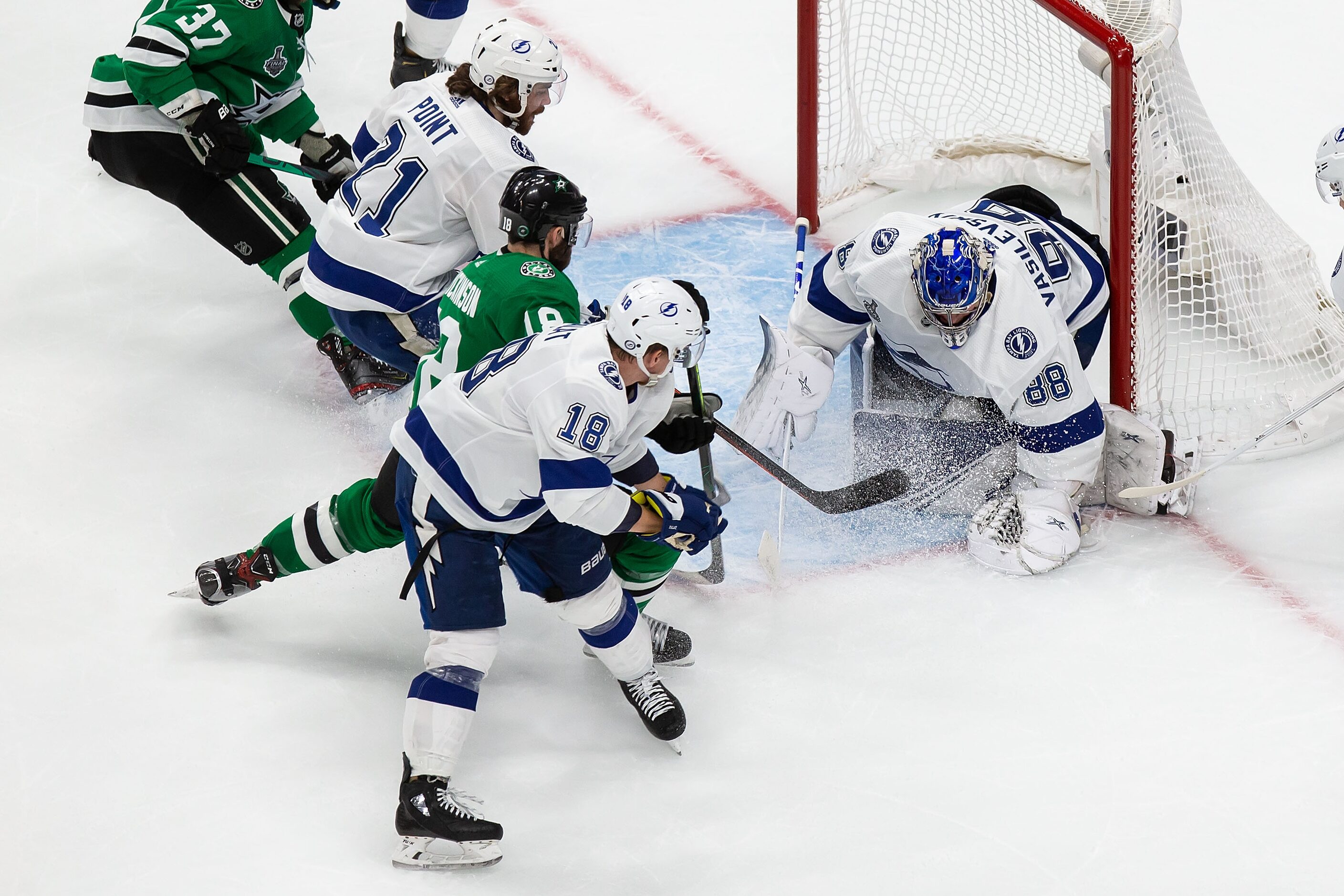 Jason Dickinson (18) of the Dallas Stars can't get past goaltender Andrei Vasilevskiy (88)...