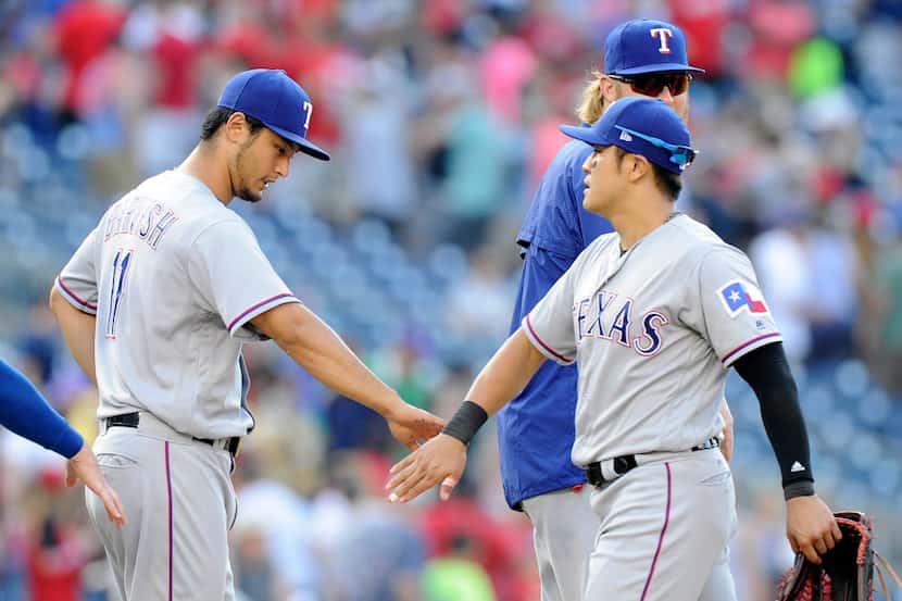 WASHINGTON, DC - JUNE 11: Yu Darvish #11 of the Texas Rangers celebrates with Shin-Soo Choo...