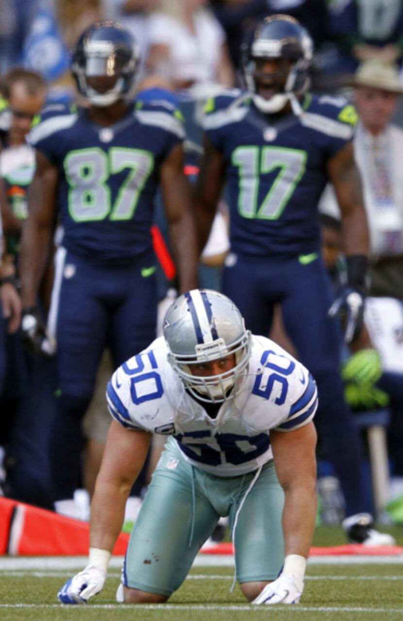 Dallas Cowboys inside linebacker Sean Lee (50) attempts to gather himself after getting hit...