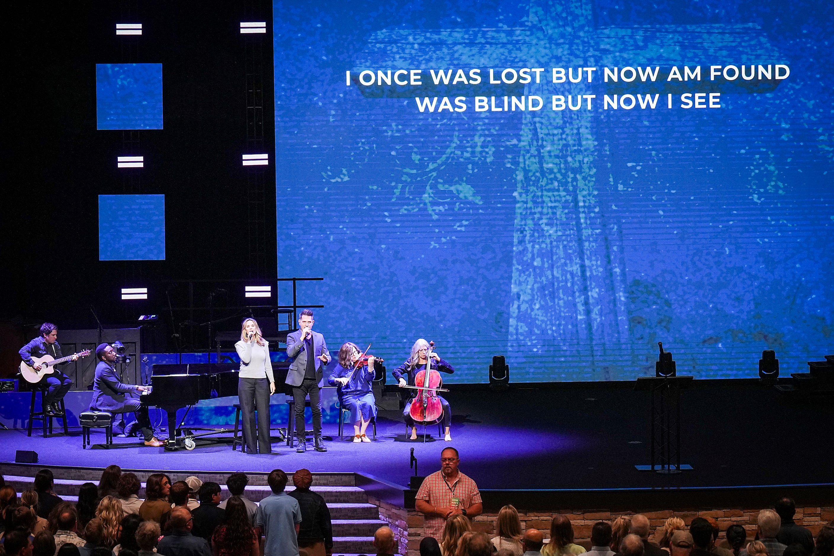 Amazing Grace is sung during a vigil at Cottonwood Creek Church a day after a mass shooting...