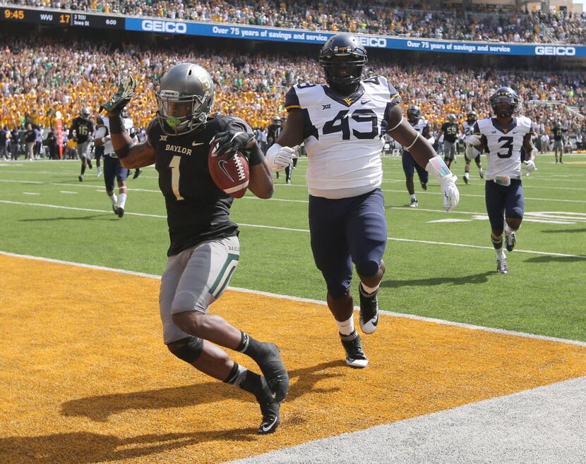 Baylor wide receiver Corey Coleman (1) scores past West Virginia defensive lineman Eric...