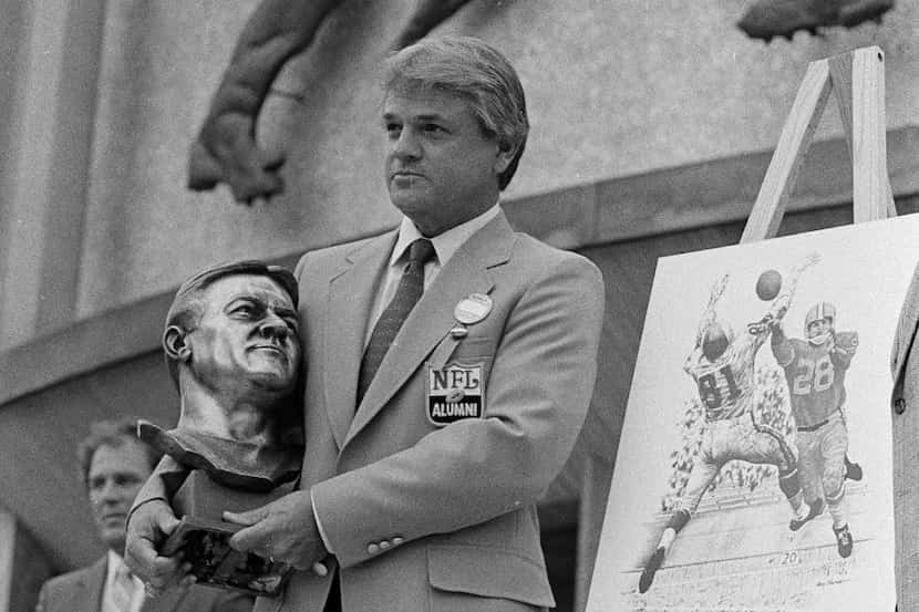 FILE - In this July 28, 1979, file photo, Yale Lary poses with his bust and drawing after...
