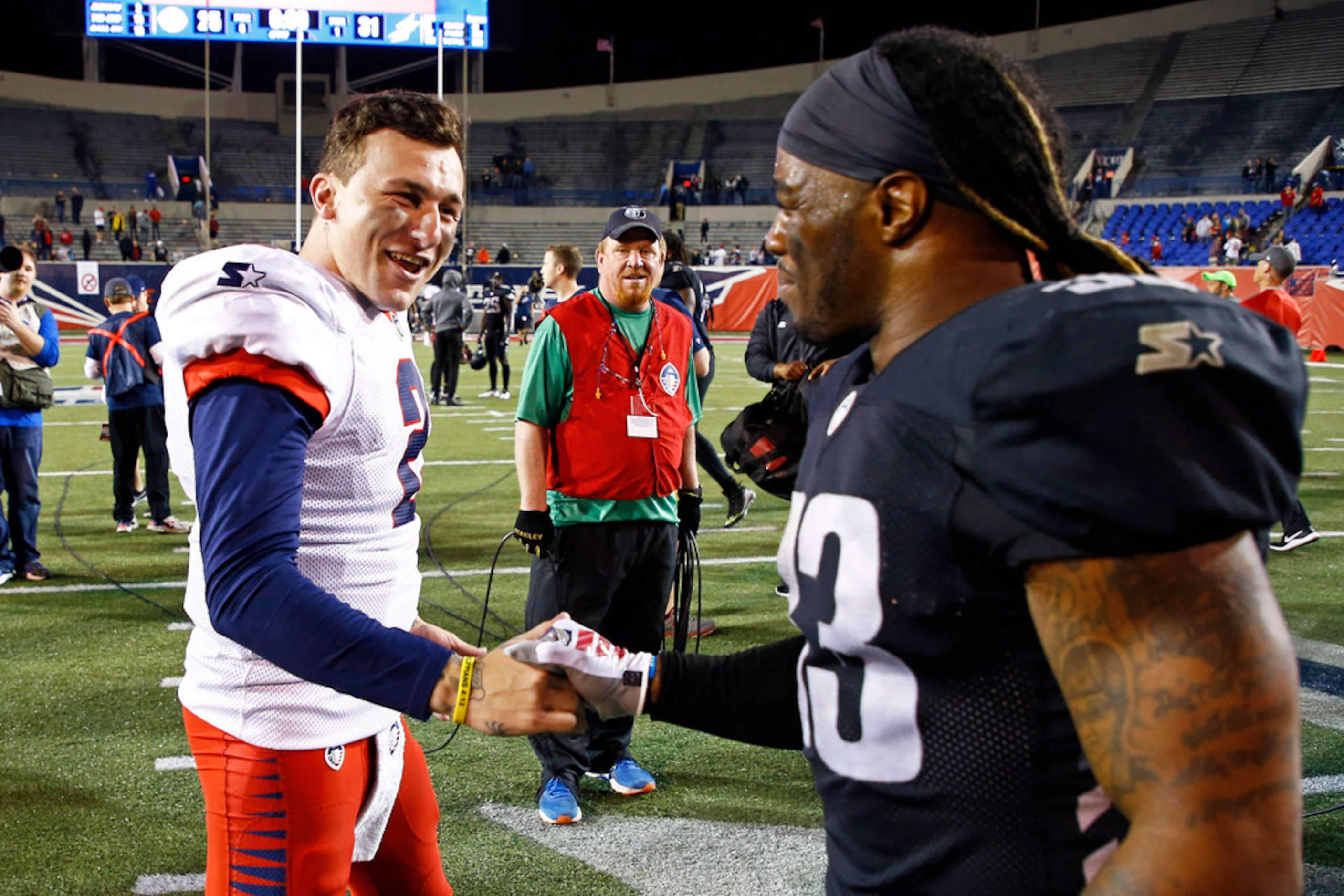 Memphis Express quarterback Johnny Manziel (2) is congratulated by Birmingham Iron running...