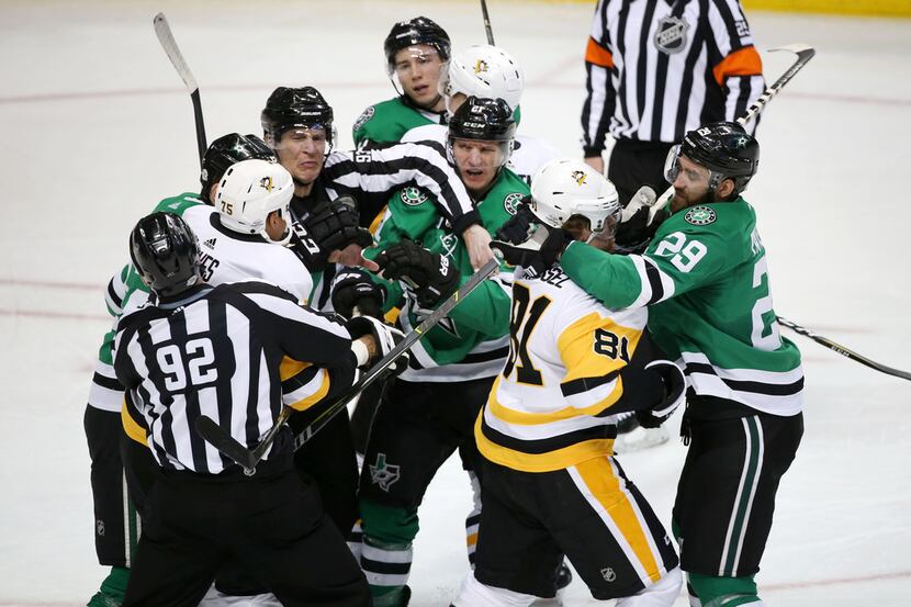 Dallas Stars players and Pittsburgh Penguins break out into a fight in the first period at...