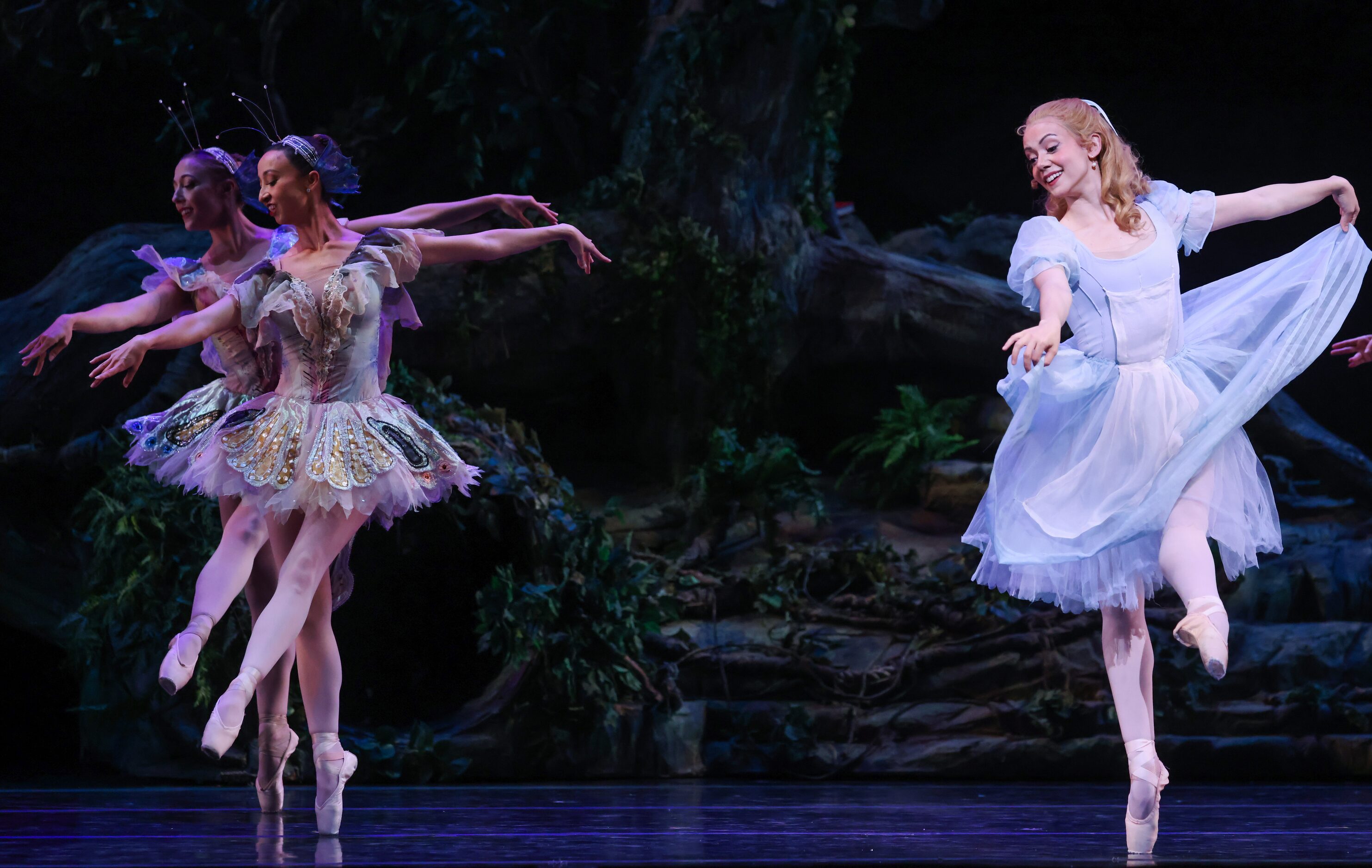 Butterflies Samantha Pille (left back) and Amanda Fairweather (front) dance with Alice...