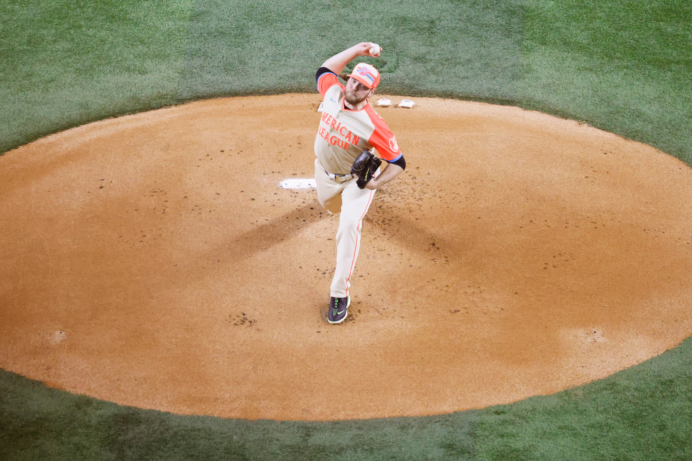 American League's Corbin Burnes, of the Baltimore Orioles, throws the first pitch during MLB...