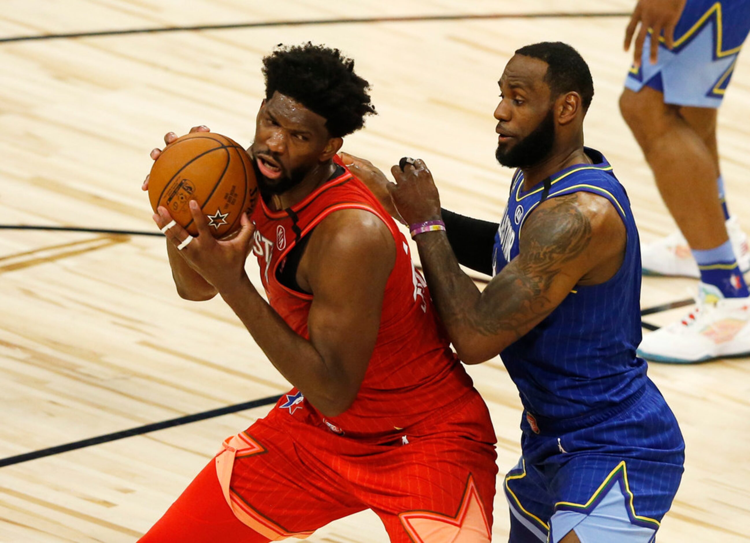 Team Giannis' Joel Embiid (24) posts up Team LeBron's LeBron James (2) during the second...